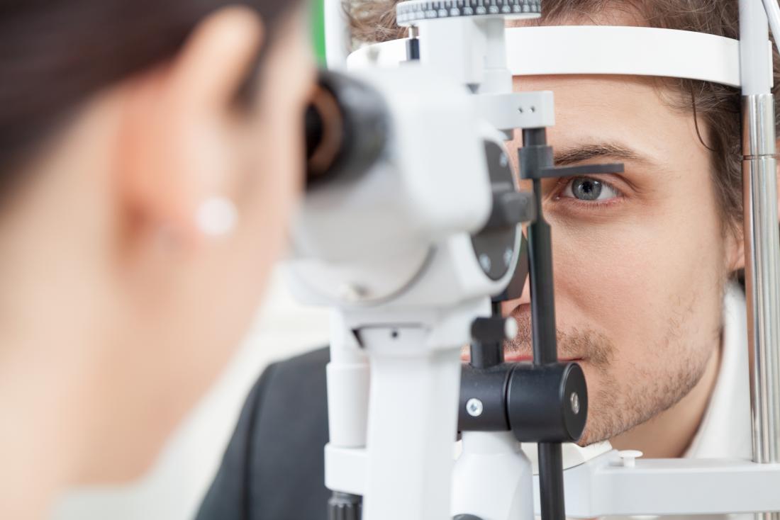 Man having eye exam at opticians.