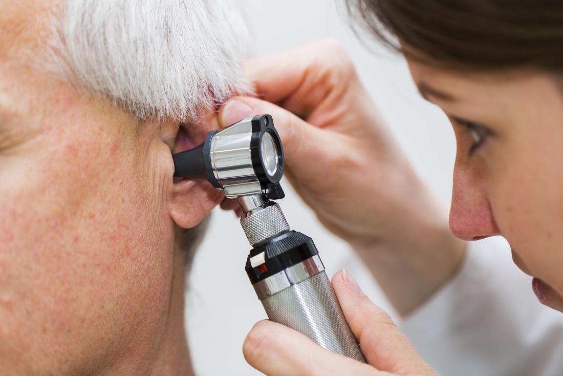 Otoscopy being performed by doctor to inspect ear
