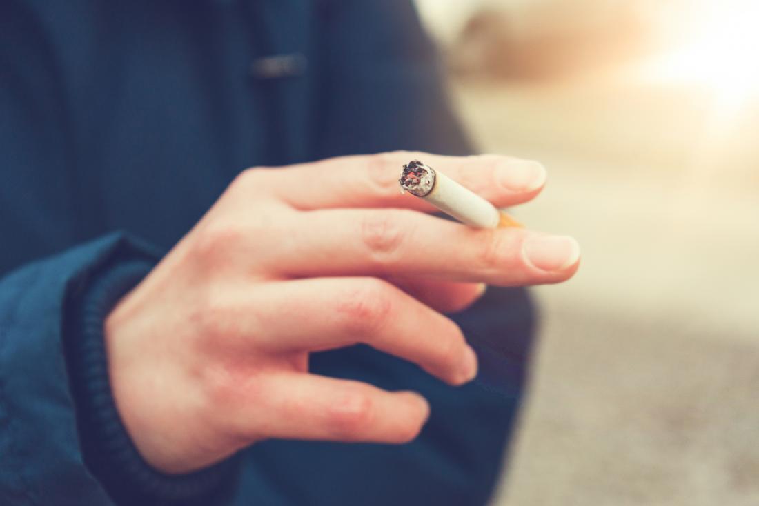 woman holding a cigarette