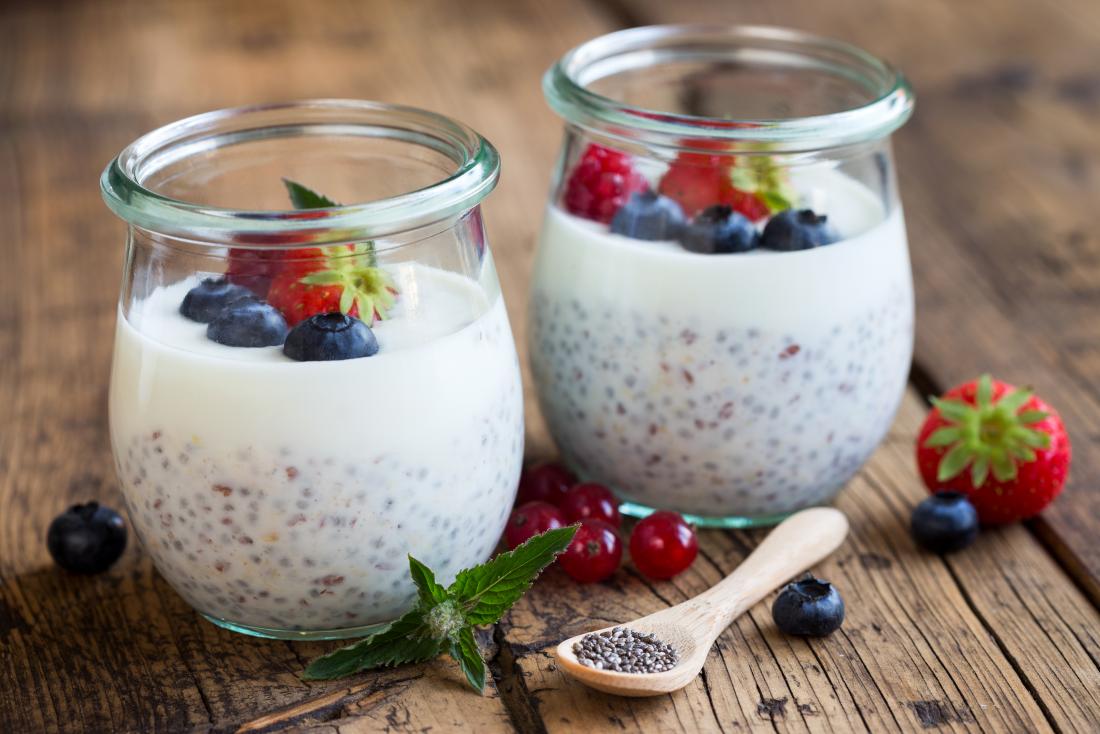 Coconut pudding in ramekins with chia seeds and berries