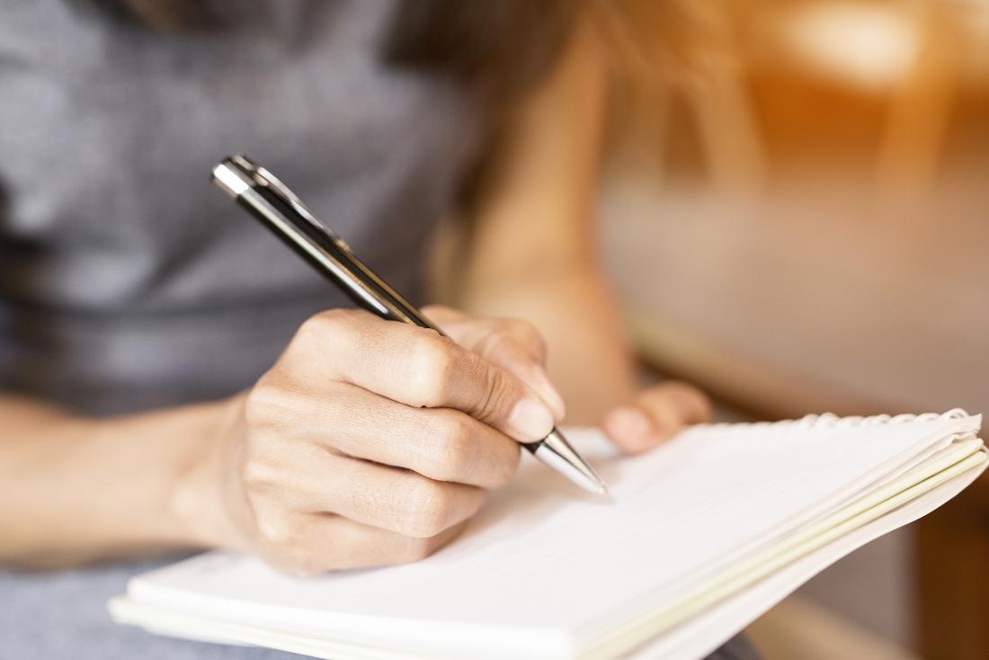 Person making notes in a journal