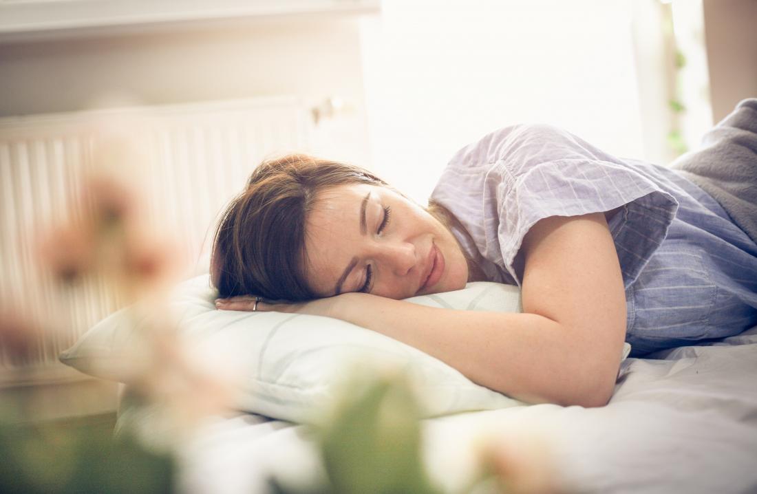 Woman smiling and sleeping