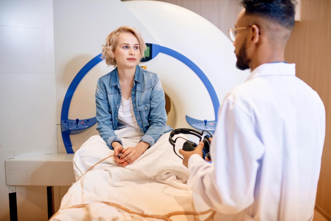 Doctor speaking with a patient before an MRI scan