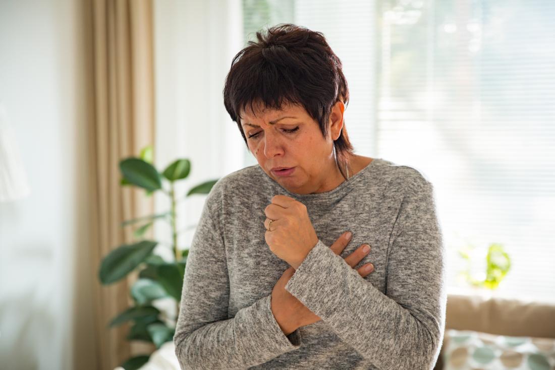 mature woman coughing