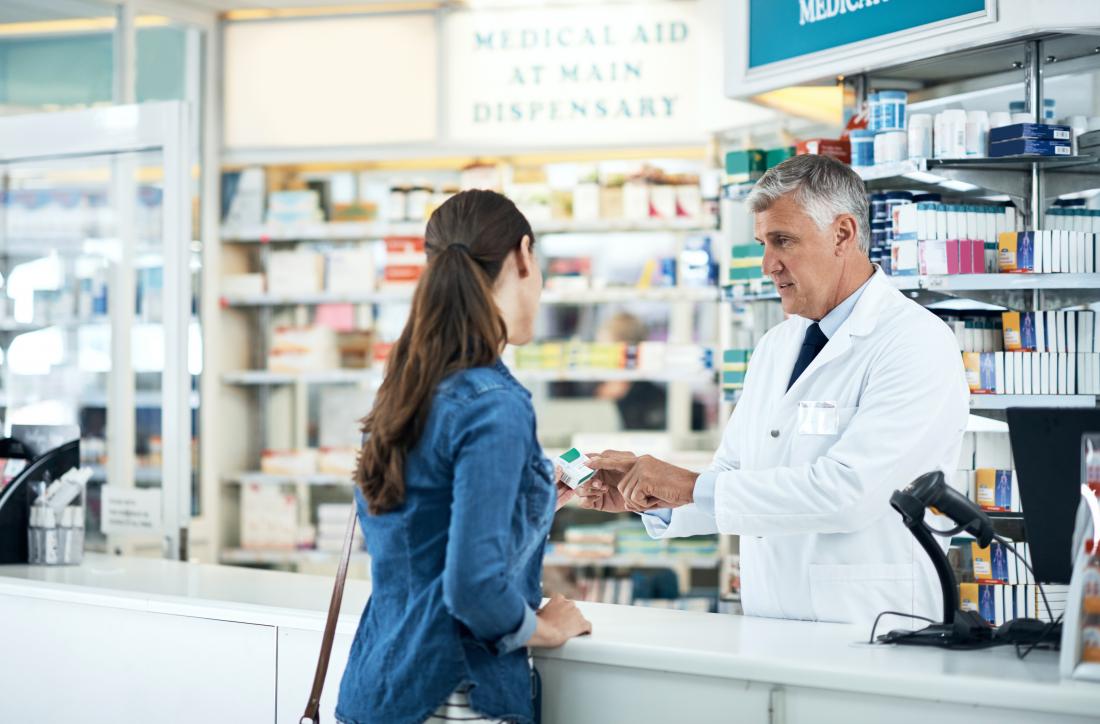 woman speaking to pharmacist