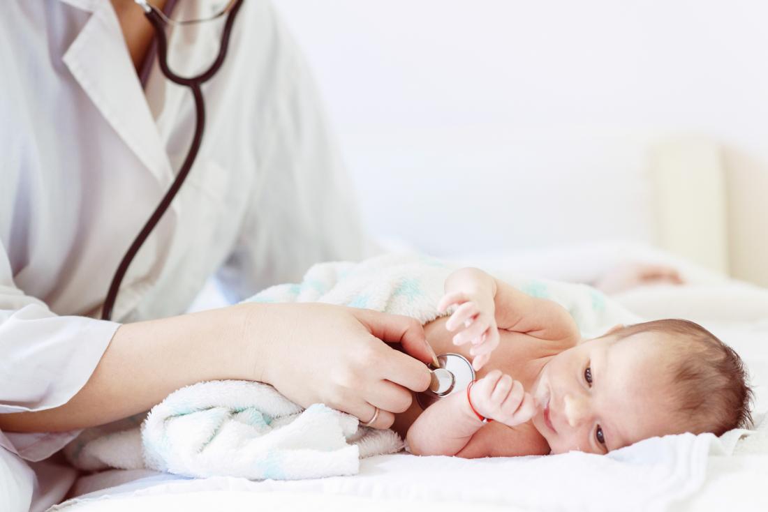 Doctor examining a baby