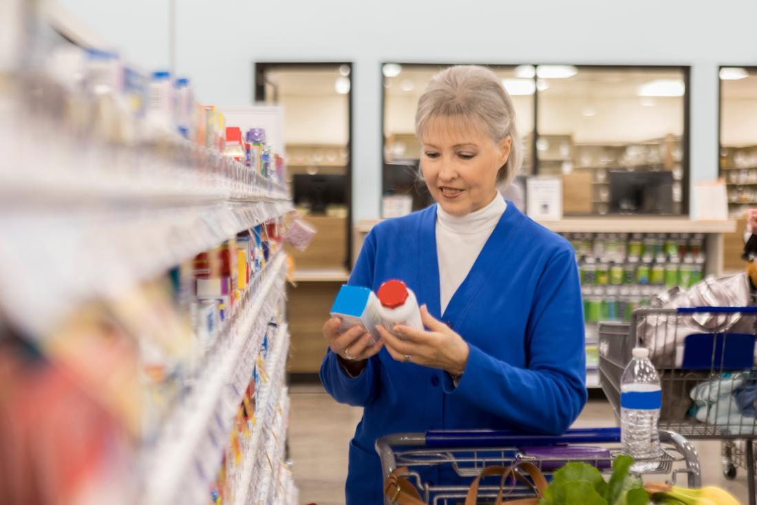 Senior lady looking at natural progesterone products