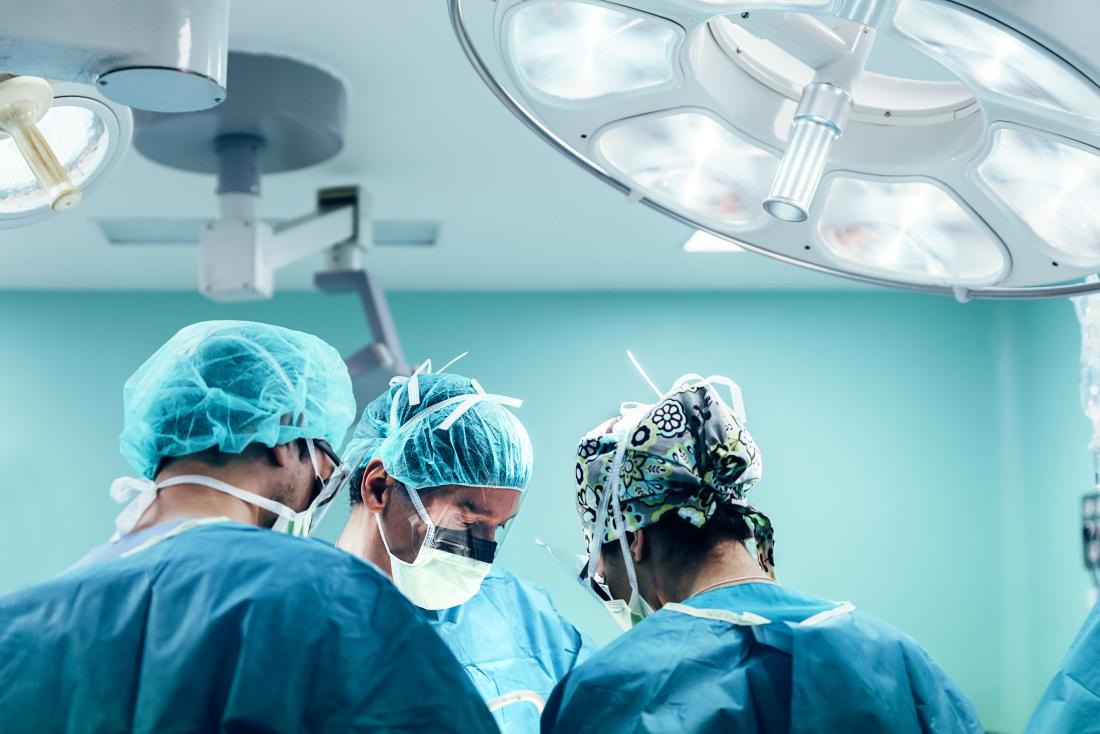 surgeons working in an operating theatre