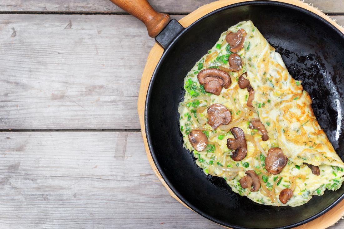Mushroom and leek omelet in pan