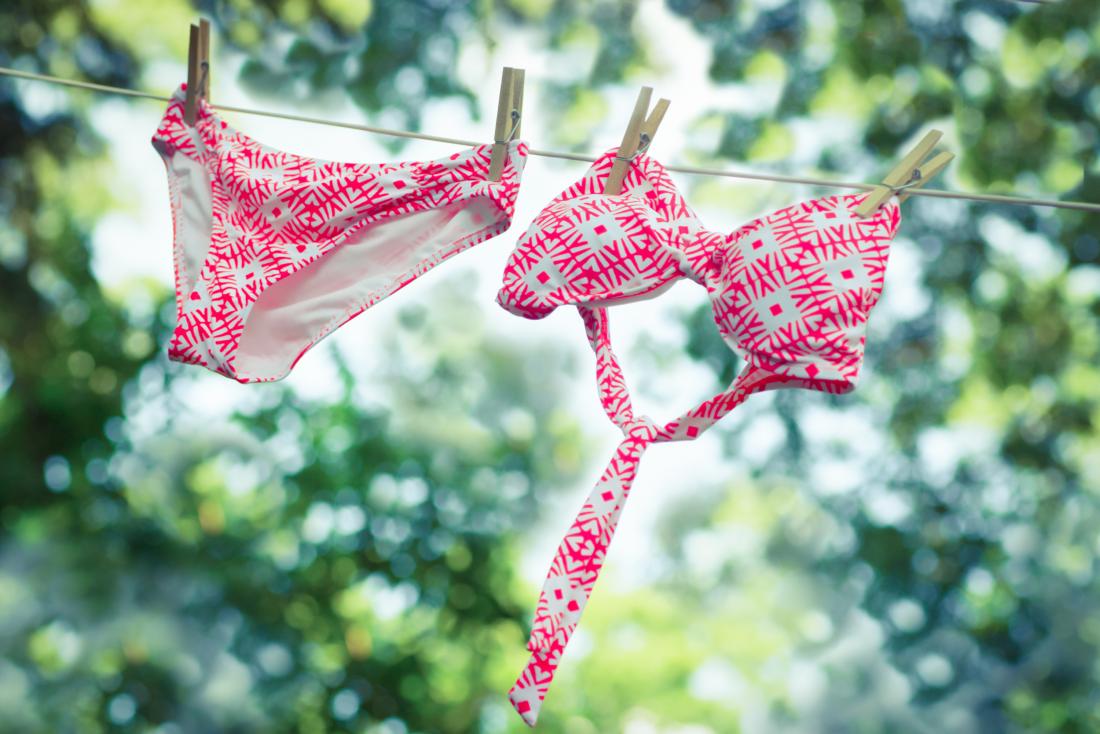 Bikini swimwear drying on clothing lines outdoors