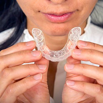 TMJ syndrome treatments vary but focus on treating the symptoms of TMJ.