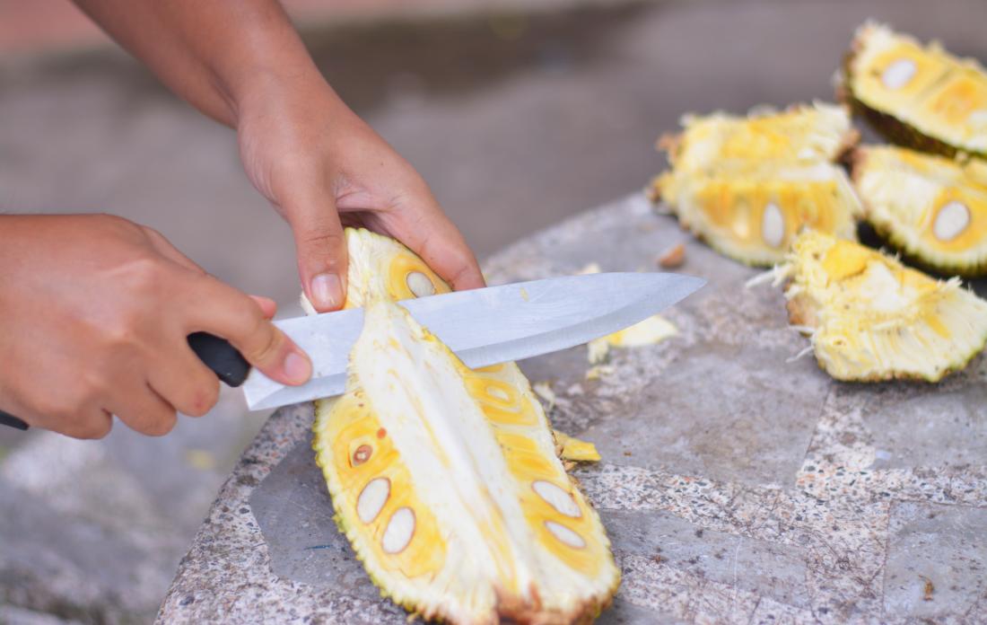 Person cutting up jackfruit