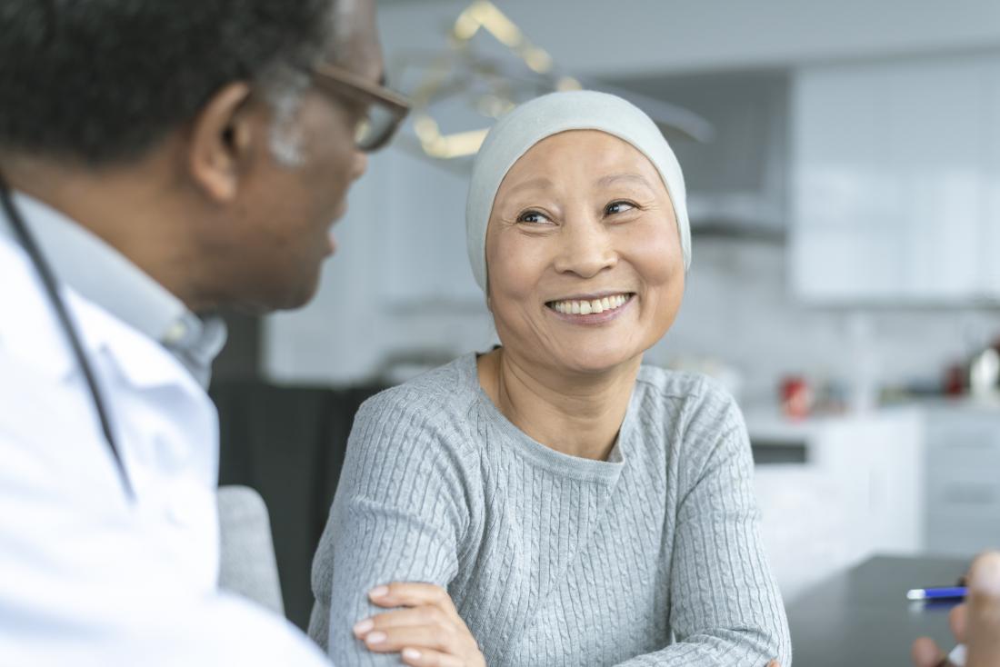 cancer survivor speaking to her doctor