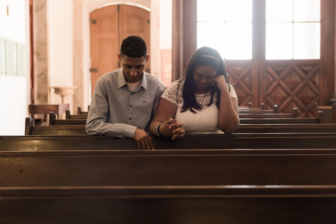 young couple praying