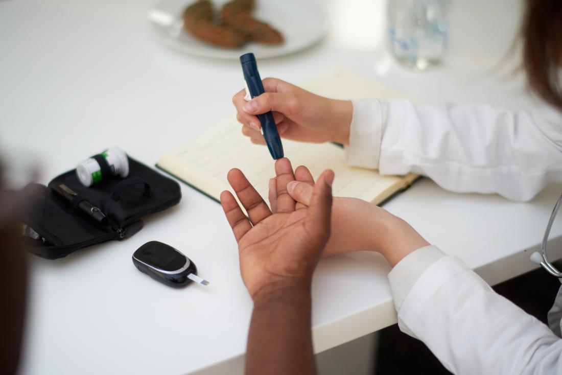 Doctor checking patient with diabetes