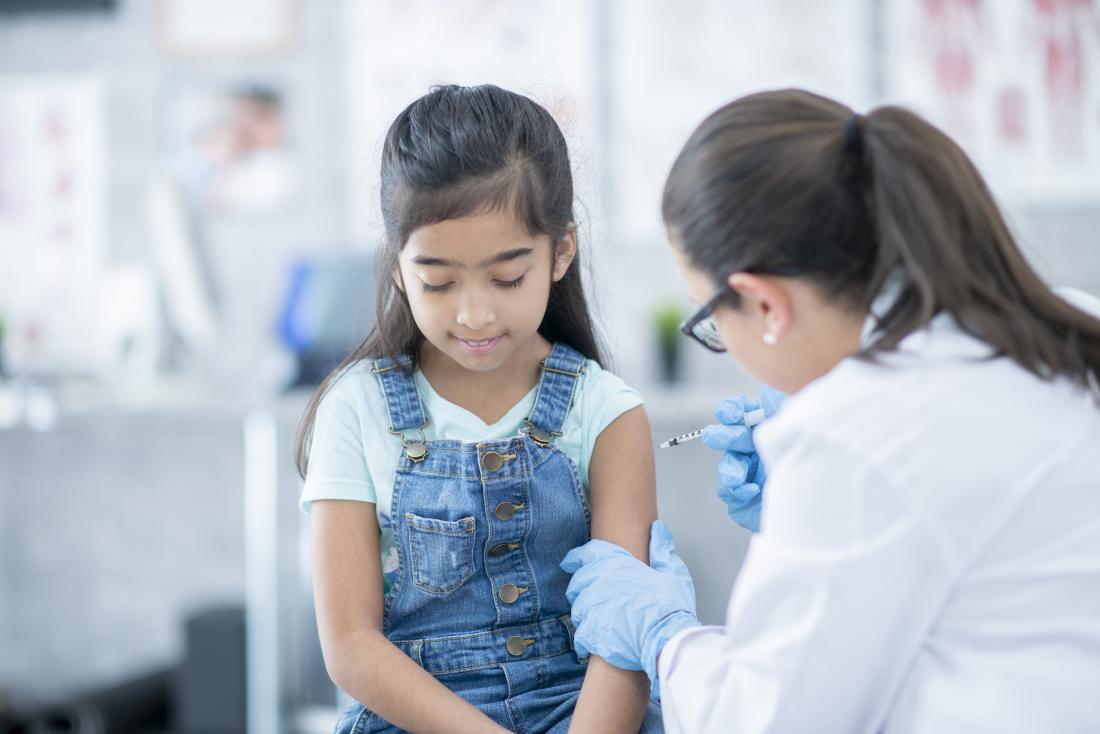 Young girl receiving a vaccination