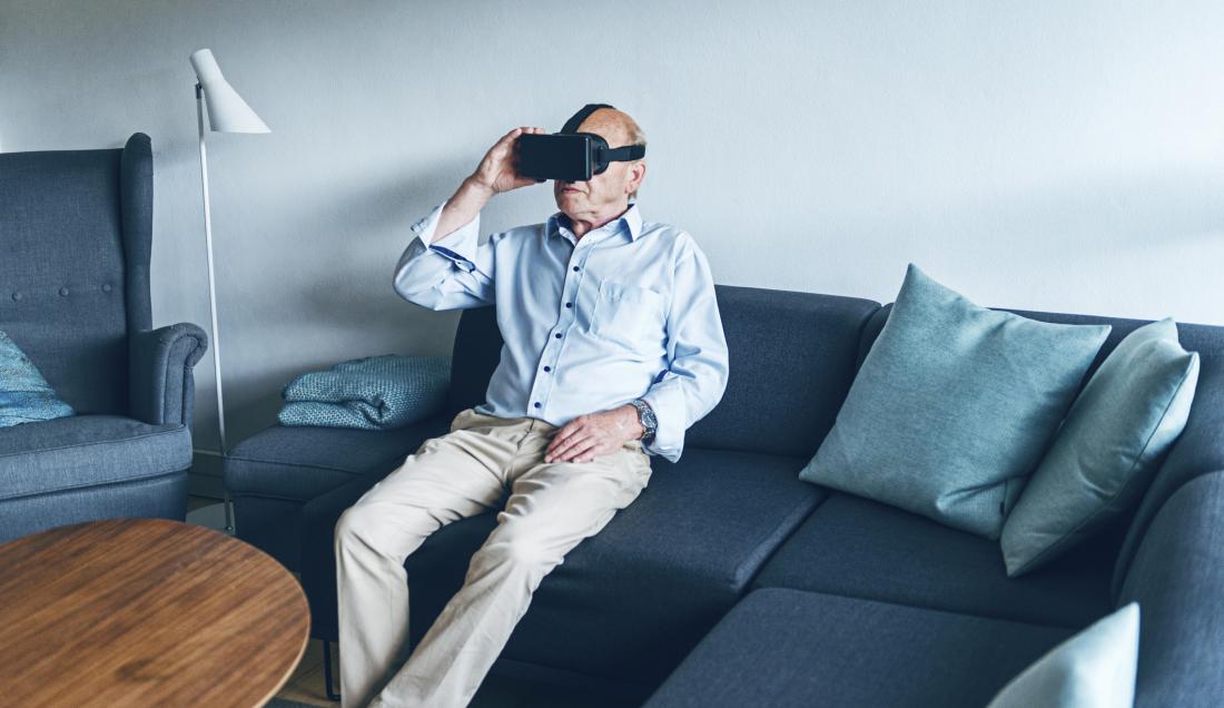 SENIOR Man trying on a VR headset