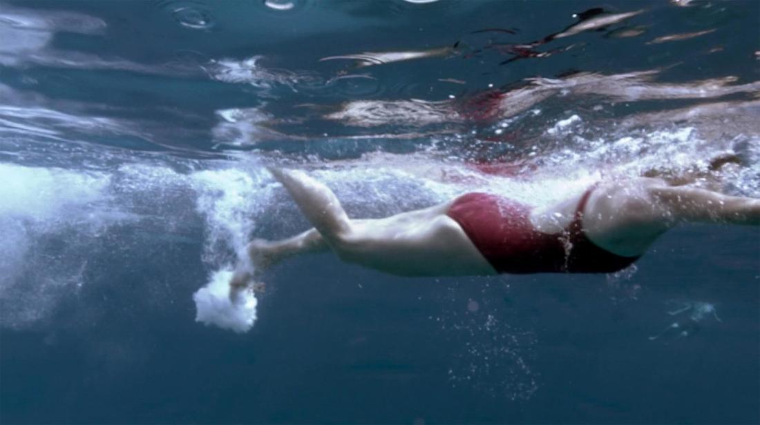 woman swimming for her knee