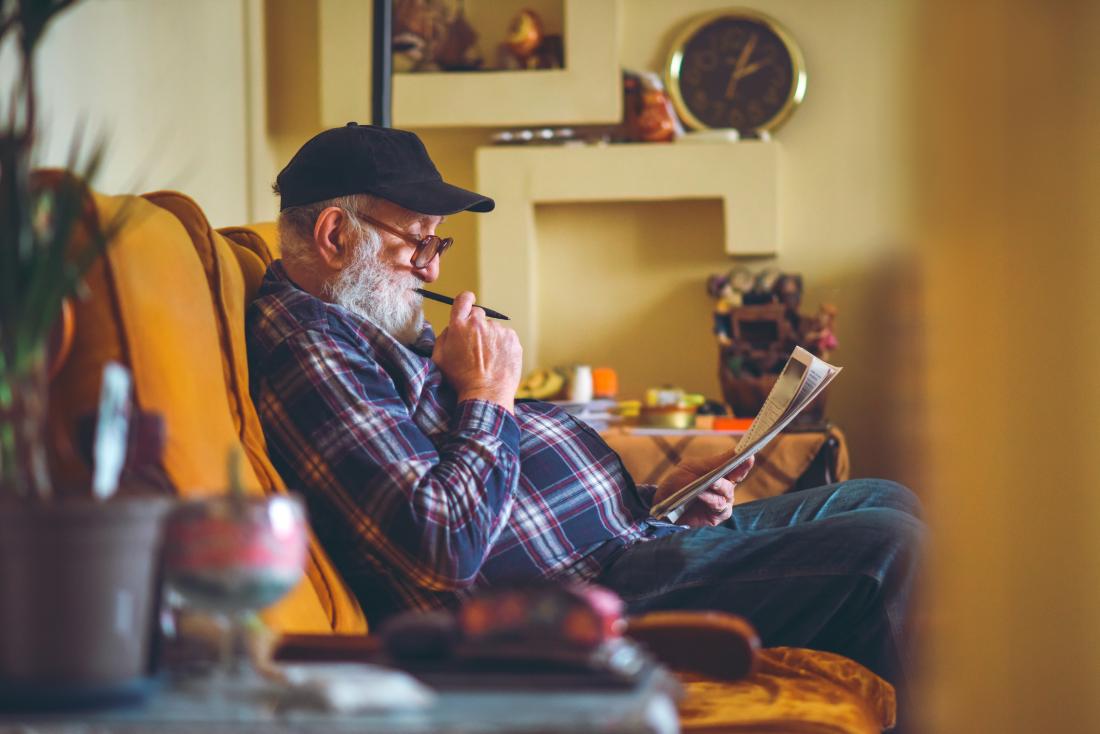Older adult doing crossword