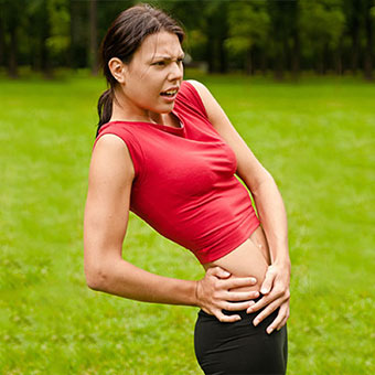 A woman experiences hip pain caused by bursitis.