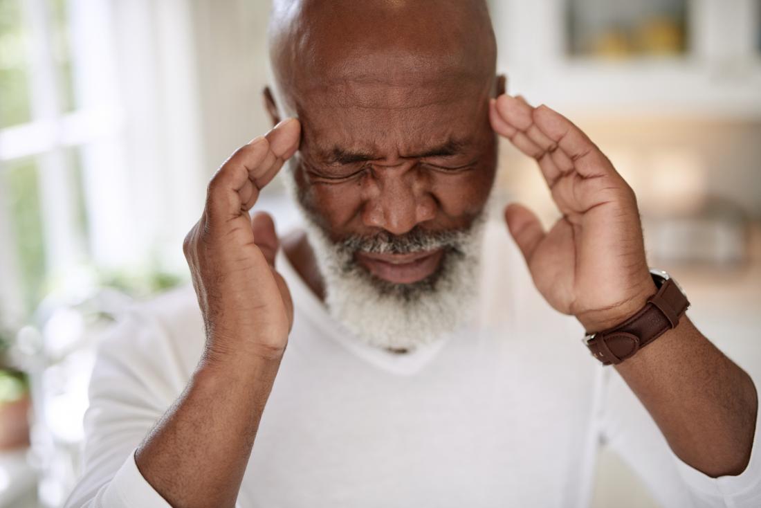 senior man with acute migraine