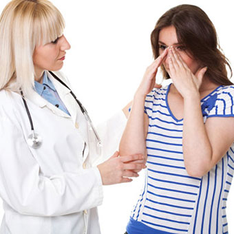 A doctor examining a patient with a sinus infection.