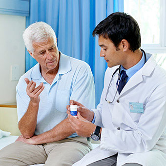 A doctor discussing medication and treatment options with a patient.