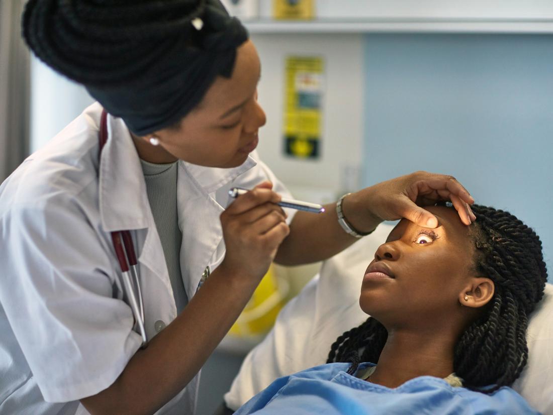a patient in an ophthalmology department being assessed by a Ophthalmologist.