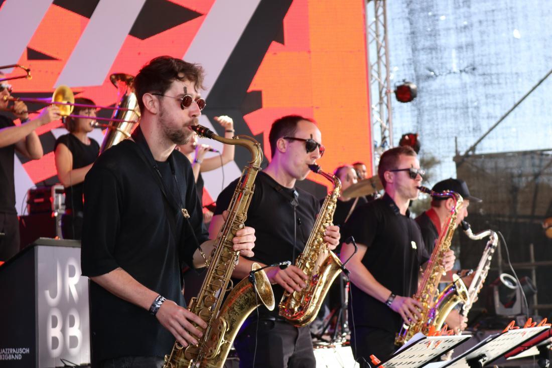 men playing saxophone in a brass band