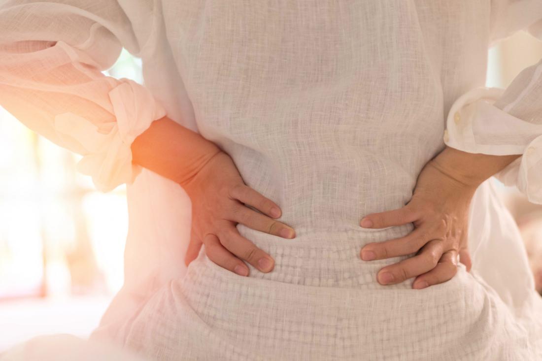 woman having back pain from kidney pain