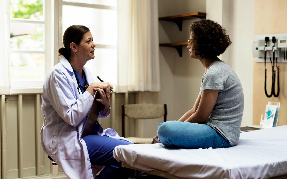 a doctor discussing non hodgkins lymphoma with a female patient 