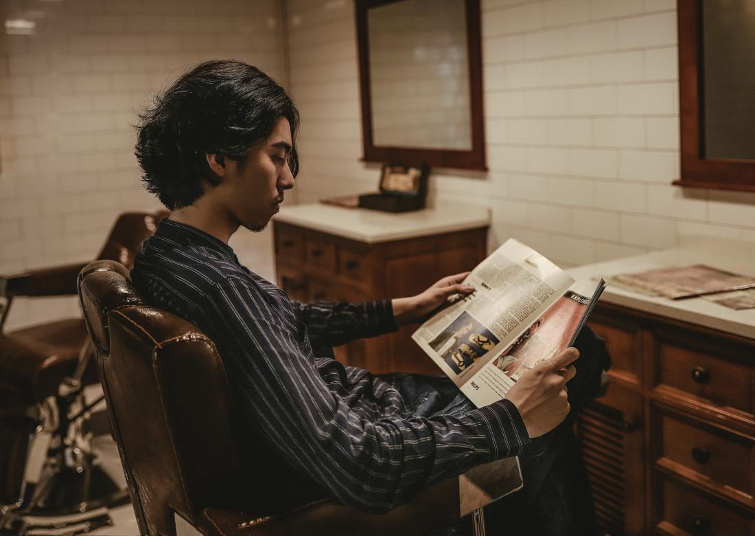 person reading a magazine