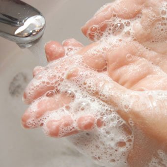 Washing hands with soap and water can help prevent the spread of impetigo.