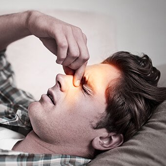 Sinus headache symptoms include excess mucus, swelling and pain in the sinuses.