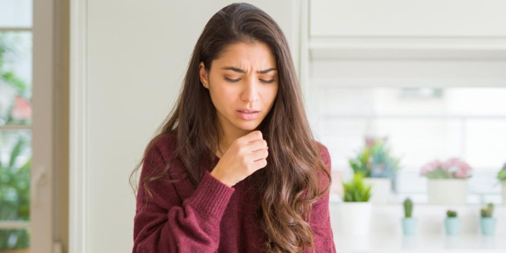 What can cause a dry cough?