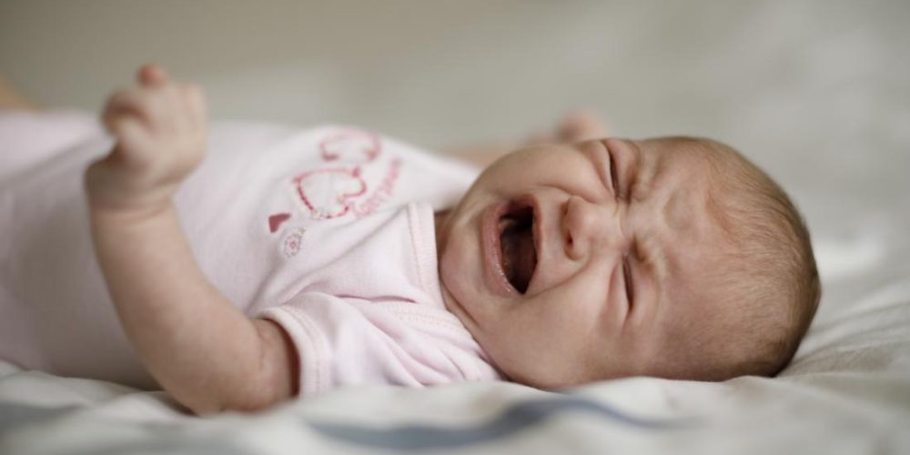How to soothe a baby crying in their sleep