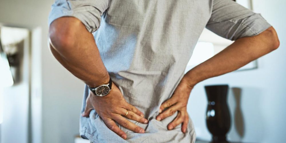 What can cause back pain while breathing?
