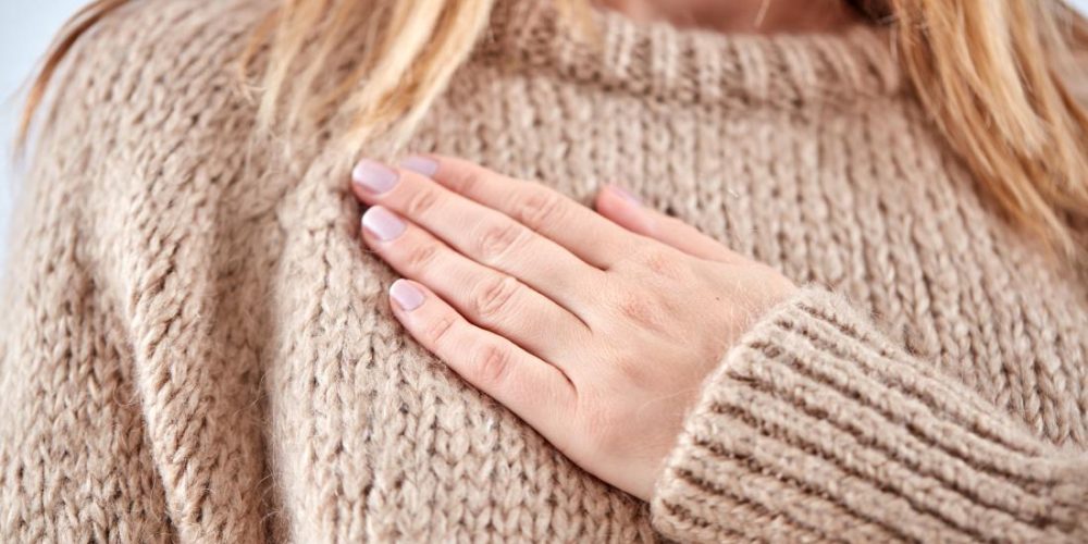 Why are my breasts sore before a period?