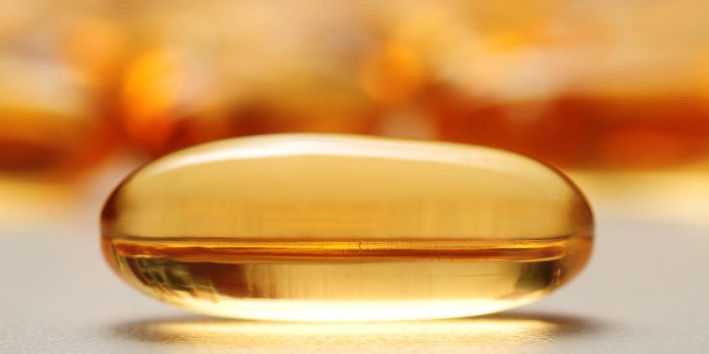 What dictates how vitamin E supplements affect cancer risk?